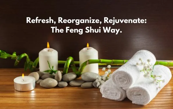 Candles, bamboo, and towels on a wooden surface, showcasing the Feng Shui-inspired way to refresh your home.