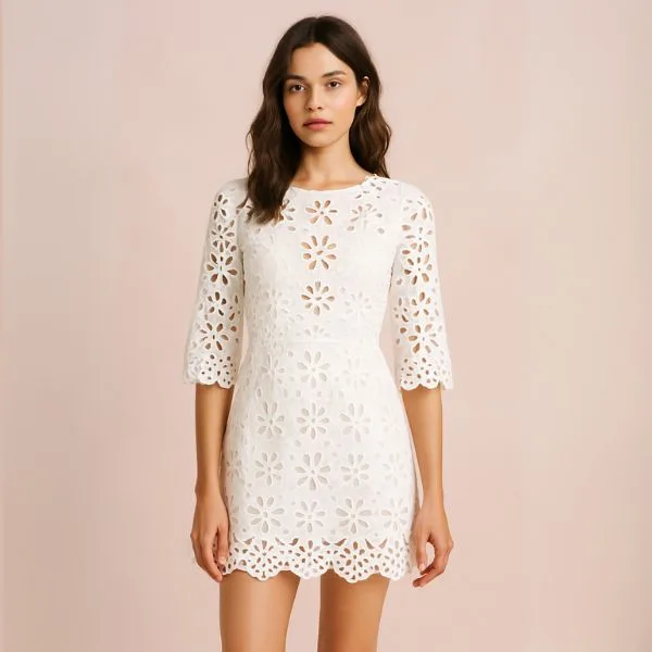 White laser-cut mini dress with floral pattern – perfect for spring floral outfits.